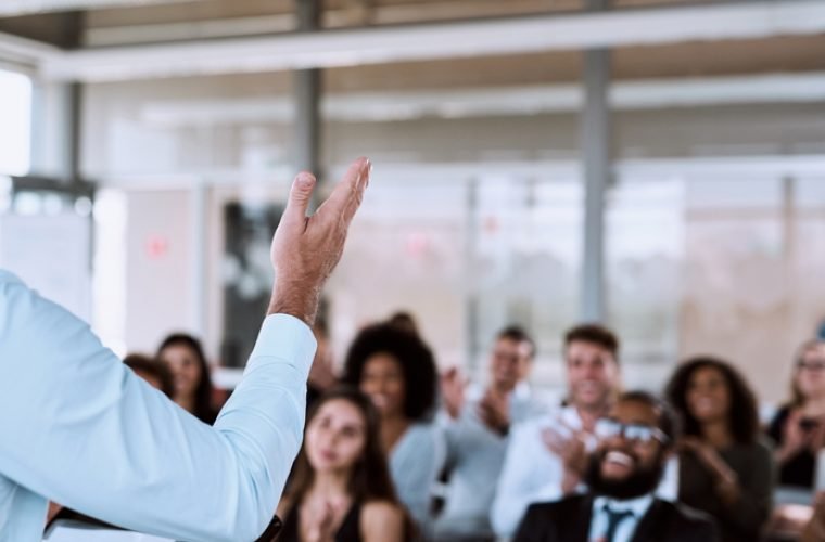 Cropped shot of a businessman delivering a speech during a conference